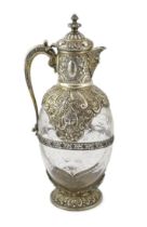 An ornate late Victorian silver mounted cut glass claret jug, by Charles Edwards, of ovoid form,