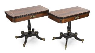A pair of Regency brass inset rosewood and ebonised card tables with D shaped tops, the friezes