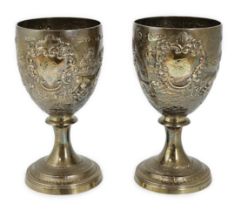 A pair of George III silver goblets, by Robert & Samuel Hennel, later embossed with continuous