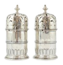 A good pair of late George I silver lighthouse casters, by William Spackman, with demi fluted bases,