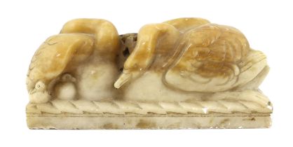§ § William McMillan A.R.A. (1887-1997), a carved alabaster group 'Swans', 43cm wide, 18cm high***