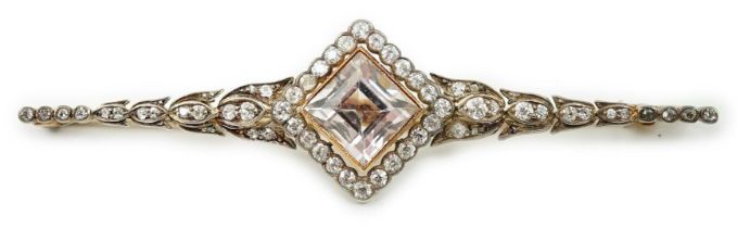 An early to mid 20th century gold and silver, pale pink topaz and millegrain set diamond cluster bar