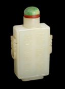 A good Chinese pale celadon jade rectangular snuff bottle, 19th century, carved in high relief to