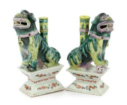 A pair of Chinese enamelled porcelain ‘Buddhist lion’ joss stick holders, early 19th century, the