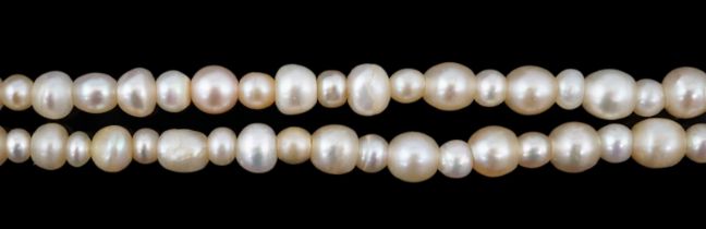 A late 19th century single strand graduated natural saltwater pearl necklace, with a French 18ct
