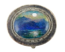 A George V Arts & Crafts Liberty & Co silver and enamel oval pill box, with hinged cover,