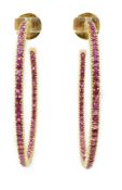 A large pair of gold and ruby chip set hoop earrings, one stone missing, diameter 48mm, gross weight