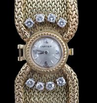 A lady's 18ct gold and eight stone diamond set manual wind cocktail, the dial inscribed Cartier,