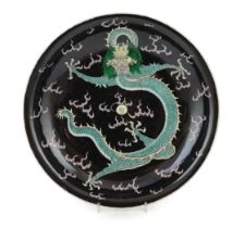 A Chinese enamelled porcelain 'dragon' dish, Kangxi mark but 19th century, boldly painted to the