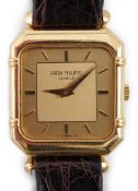 A lady's 18ct gold Patek Philippe manual wind square dial wrist watch, with octagonal case and baton