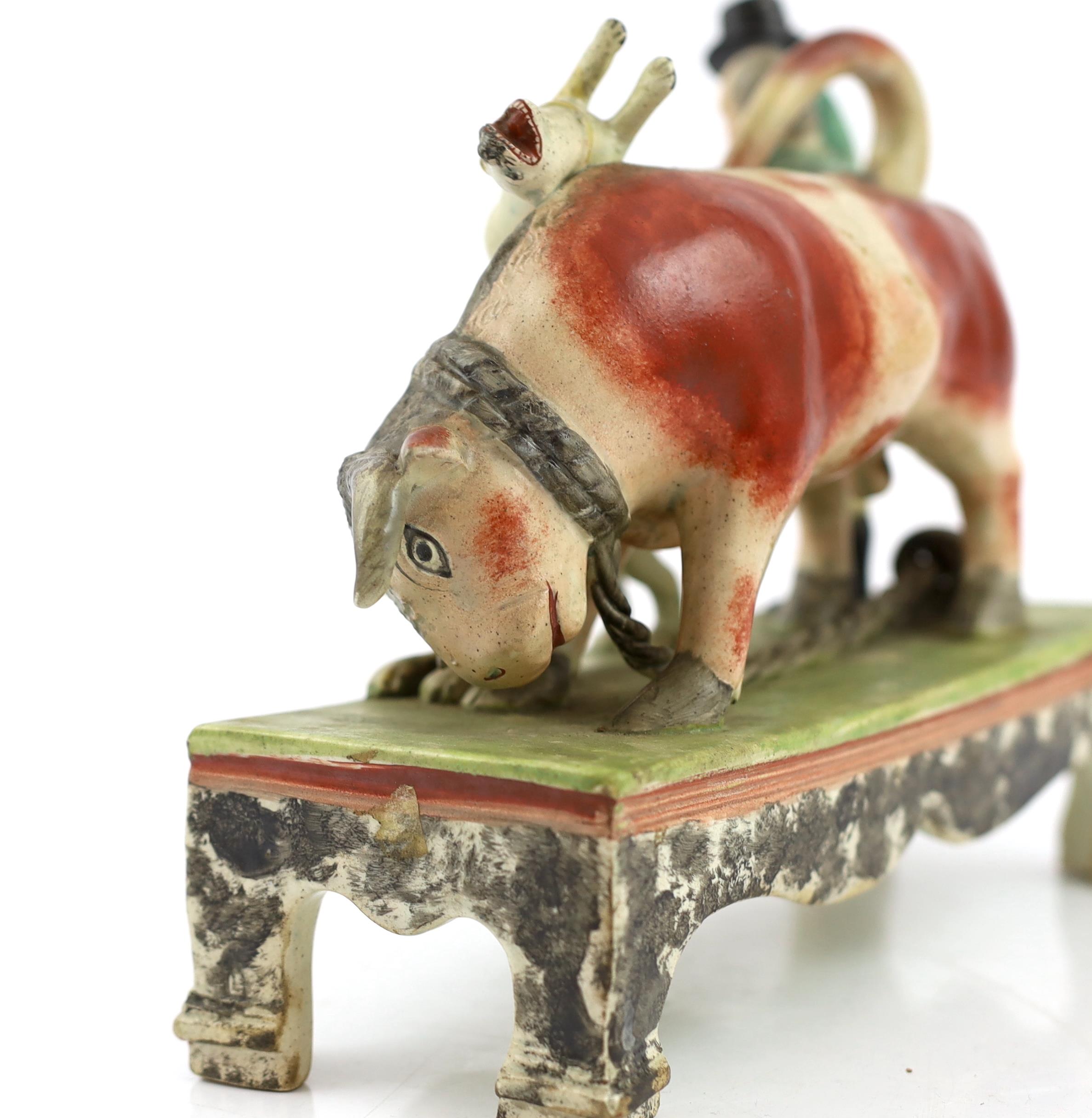 A Staffordshire pearlware bull baiting group, of Obadiah Sherratt type, c.1830, the figure of a - Image 4 of 6