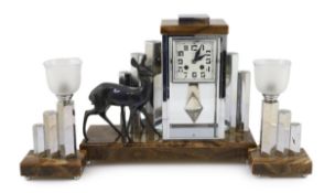 Attributed to Michel Decoux, a French Art Deco chrome and marble clock garniture, the central