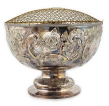 A large Edwardian repousse silver rose bowl, by Carrington & Co, with foliate scroll decoration,
