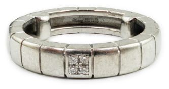 A modern Chopard 18ct white gold and four stone diamond chip cluster set band, signed and numbered
