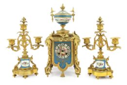 A 19th century French ormolu and Sevres style porcelain clock garniture, the mantel clock with