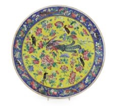 A Chinese yellow ground famille rose dish, late 19th century, with unusual Western script ‘F.L’ seal