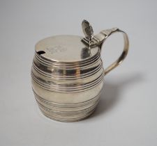 A George III silver barrel shaped mustard pot, Thomas Daniell, London, 1780, 8cm, with later blue