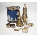 A silver sugar caster, serviette rings, a plated wine funnel, a Wedgwood biscuit barrel, etc.