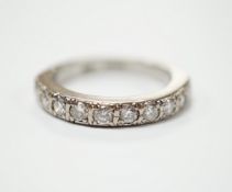 A modern 18ct white gold and nine stone diamond set half eternity ring, size M, gross weight 5.3