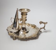 A George II silver chamberstick, with shell border, on three scroll feet, William Grundy, London,