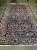 A North West Persian blue ground carpet, 315 x 158cm