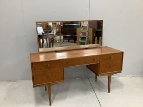 McIntosh of Kirkaldy, a mid century teak kneehole dressing table, width 141cm, depth 46cm, height