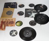 Thirteen The Beatles and related 7 inch singles; eight of which have demo stickers; ‘Factory