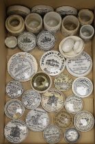 A large collection of anchovy paste toothpaste pot lids and pots together with a Brighton