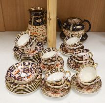 A Royal Crown Derby Imari pattern 2451 part tea set together with an Imari style jug, teapot and