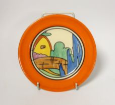 A Clarice Cliff side plate, Orange Roof Cottage, impressed date 1932, 15cm