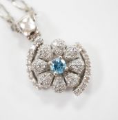 A modern 14ct gold, topaz? and simulated diamond chip cluster set pendant, 20mm, on a 9ct chain,
