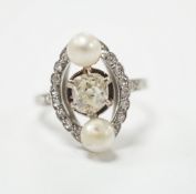 A white metal single stone diamond and two stone cultured pearl set elliptical shaped ring, size