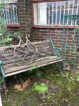 A slatted cast metal garden bench, width 127cm, height 70cm, together with a pair of wrought iron