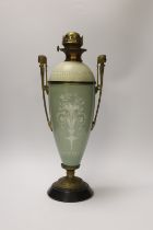 A late 19th century pate sur pate and gilt metal oil lamp with twin handles (restoration), 44cm