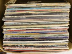A collection of LP record albums and 12” singles (approx 50), artists include; the Beatles, Cliff