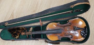 A cased 19th century Continental violin with lions head carved scroll, length of body, 35.5cm,