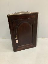 A George III oak hanging corner cupboard, width 64cm, depth 37cm, height 90cm