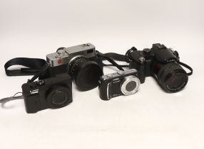 Four digital cameras; a Leica Digilux 2 and three Panasonic Leica models from the LUMIX series