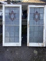 A pair of Edwardian stained glass windows, width 42cm, height 96cm