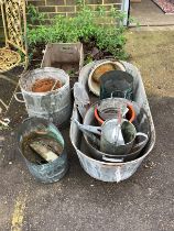 A quantity of assorted galvanised containers, a Victorian copper cauldron and terracotta pots, etc.