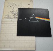 Three Pink Floyd LP record albums; Dark Side of the Moon, on Harvest SHVL 804, with both posters and