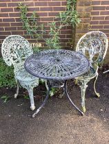 A circular metal garden table, diameter 69cm, height 66cm, and two chairs