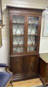 A George III and later mahogany narrow bookcase, width 96cm, depth 31cm, height 221cm