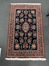 A North West Persian blue ground medallion rug, 164 x 103cm