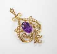 An Edwardian 15ct, amethyst and split pearl cluster set pendant, 40mm, gross weight 4.6 grams.