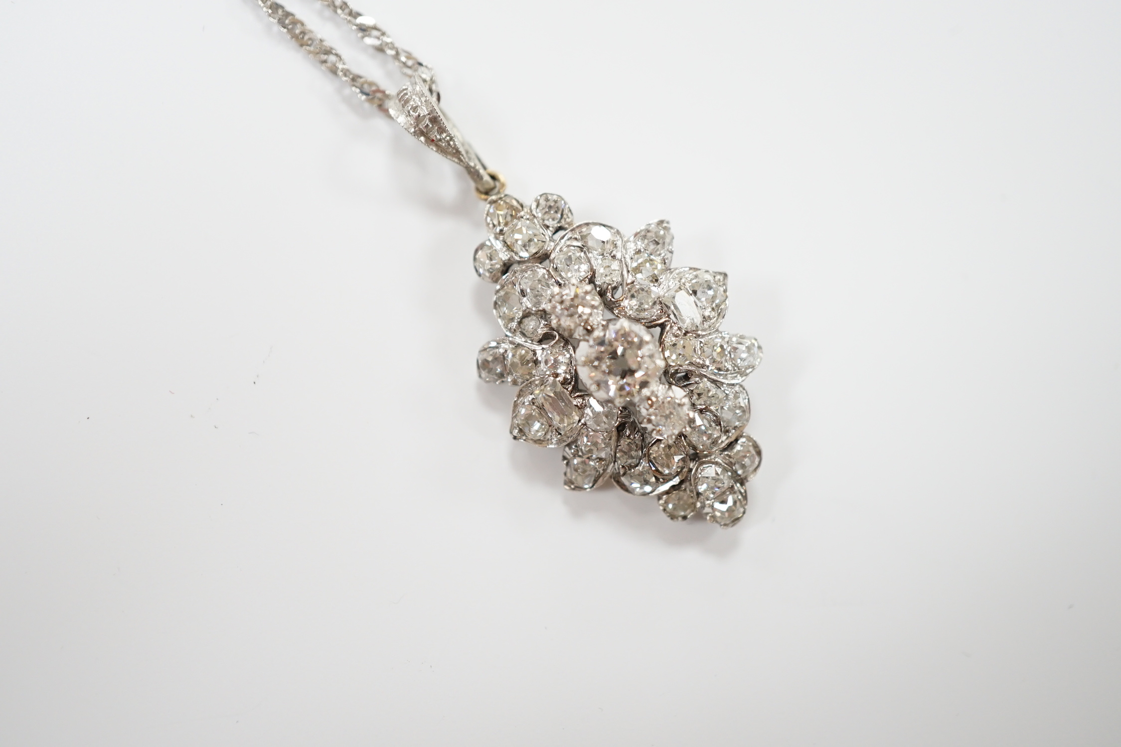 A white metal and diamond cluster set oval pendant, 27mm, on 9kt white metal chain, gross weight 5.8 - Image 2 of 4