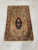 A North West Persian ivory ground silk prayer mat, 66 x 44cm