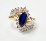 A modern 14k and single stone marquise cut sapphire and diamond chip cluster set crossover dress