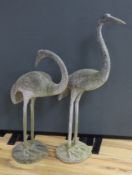 A large pair of weathered metal storks, 95cm