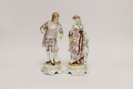 A pair of Sitzendorf figures, 21cm high